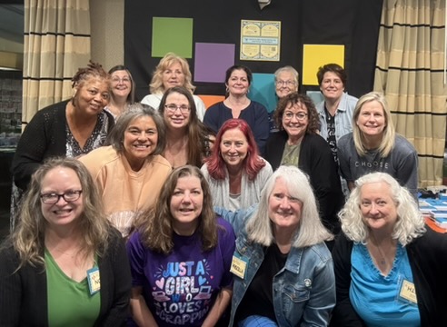 Scrapbookers gathered at an in-person Mailbox Mosaics retreat